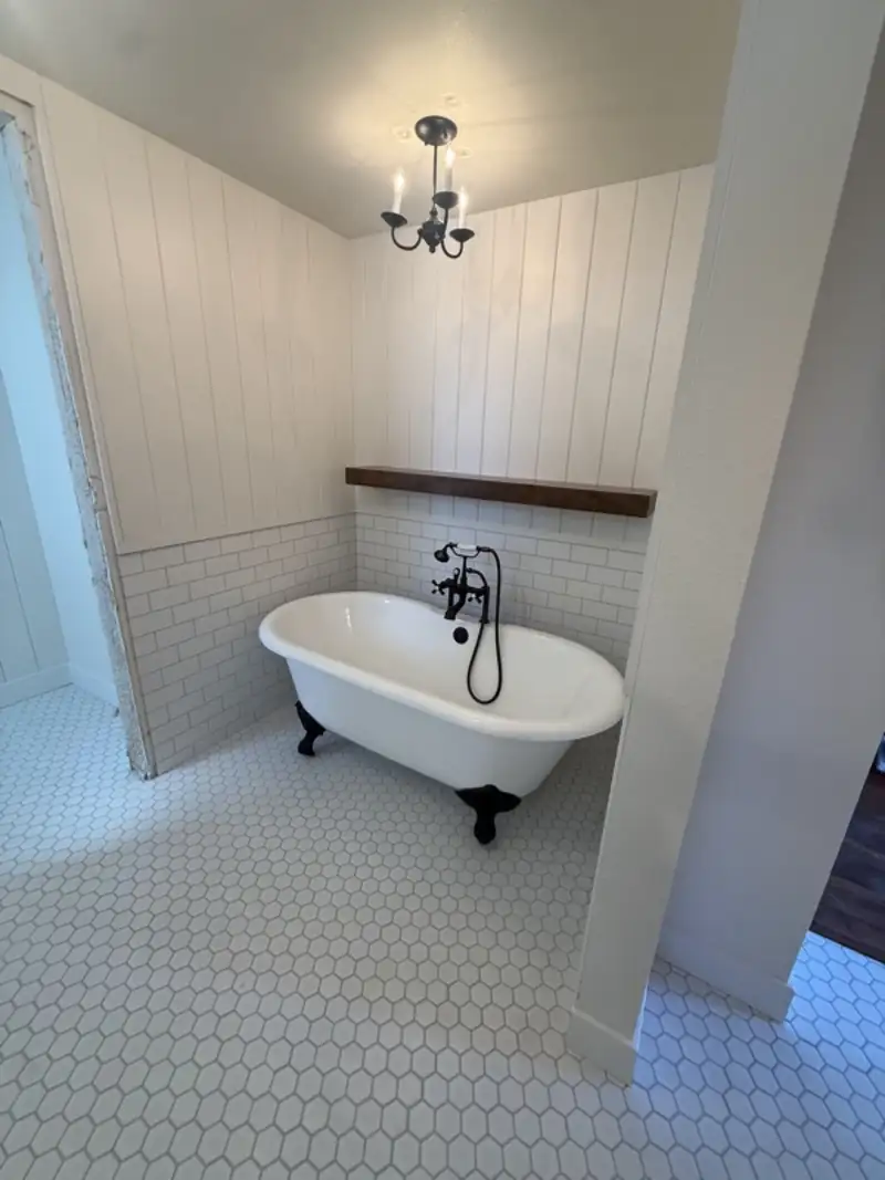 Clawfoot tub in a bathroom with shiplap walls