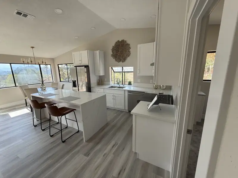 Open island kitchen with adjoining dining area